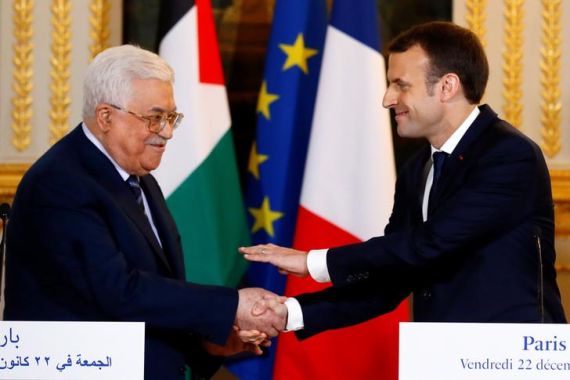 French President Macron and Palestinian President Abbas deliver a press statement after a meeting at the Elysee Palace in Paris