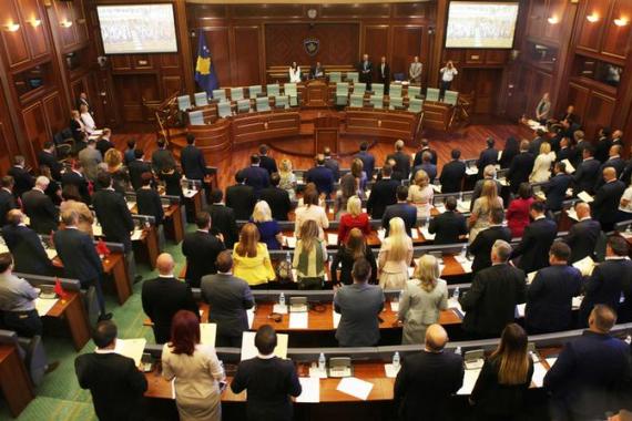 Kosovo’s newly elected members of parliament take the oath as parliament convenes for the first time since the June snap election, in Pristina
