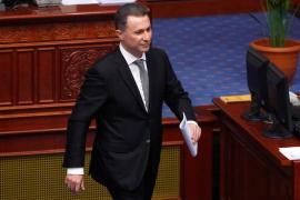 Former Macedonian PM Gruevski walks to his seat in parliament after his address to the deputies in Skopje