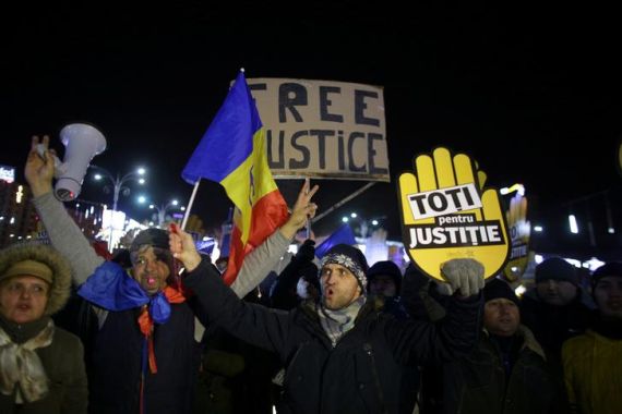 People take part in a demonstration in Bucharest