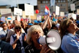 A woman takes part in a protest "Croatia can do better", against what the demonstrators say is political influence on education reform, on Zagreb's main square